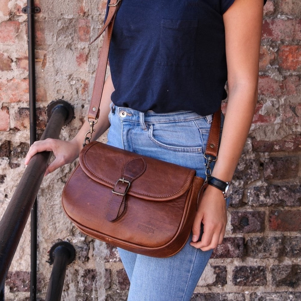Amelia Saddle Bag in Pecan slung over woman