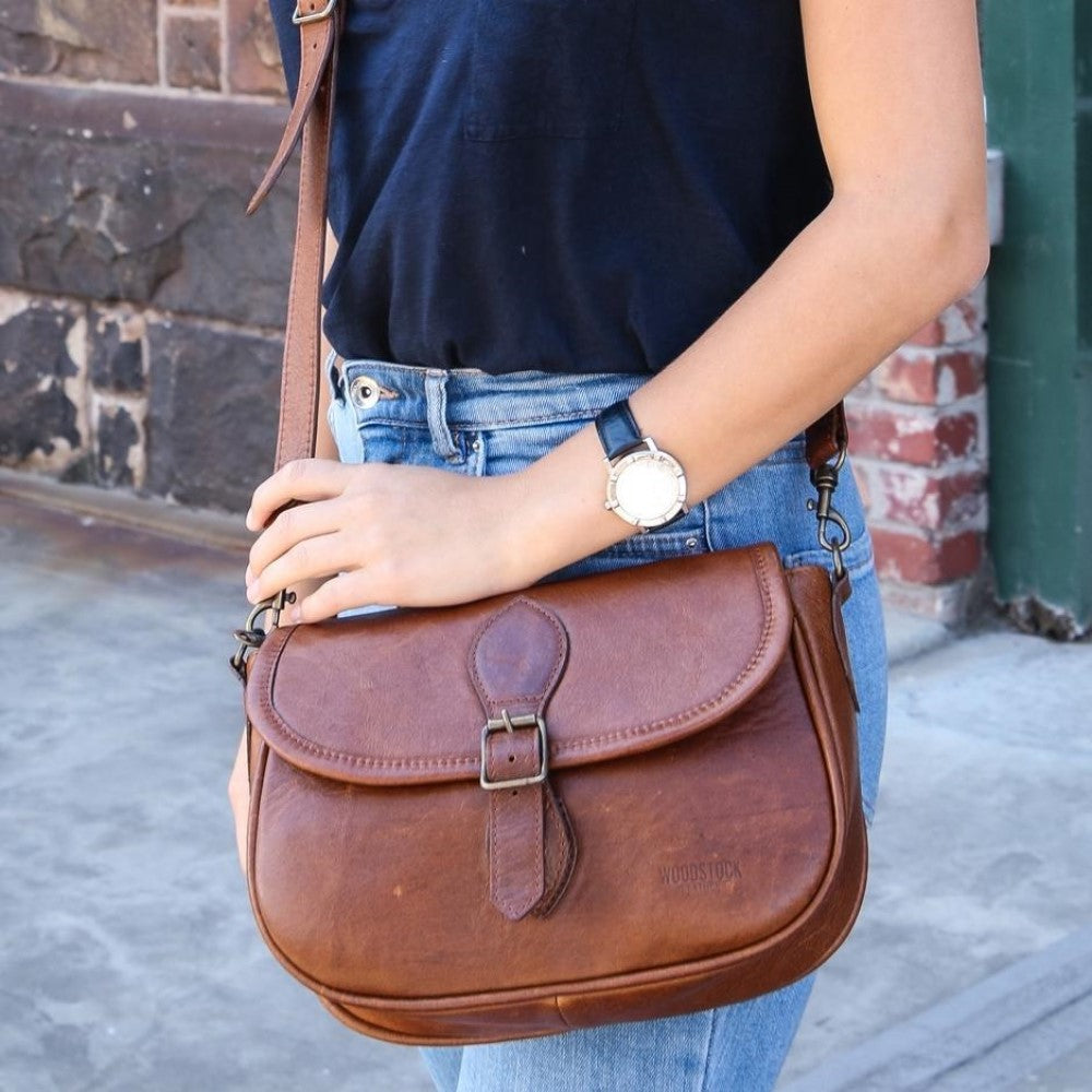 Woman carrying Amelia Saddle Bag-Pecan