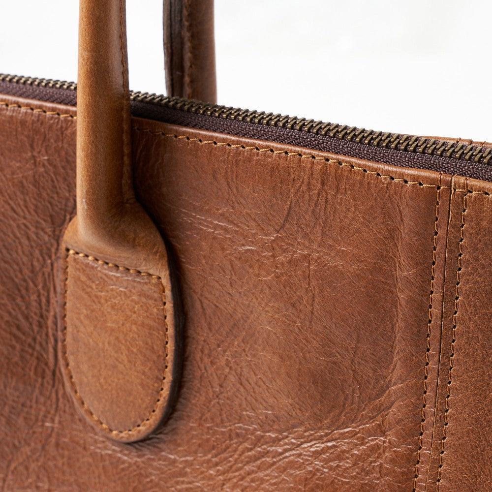 Handle attachment and zipper on Lined Lexi Work Bag - Pecan