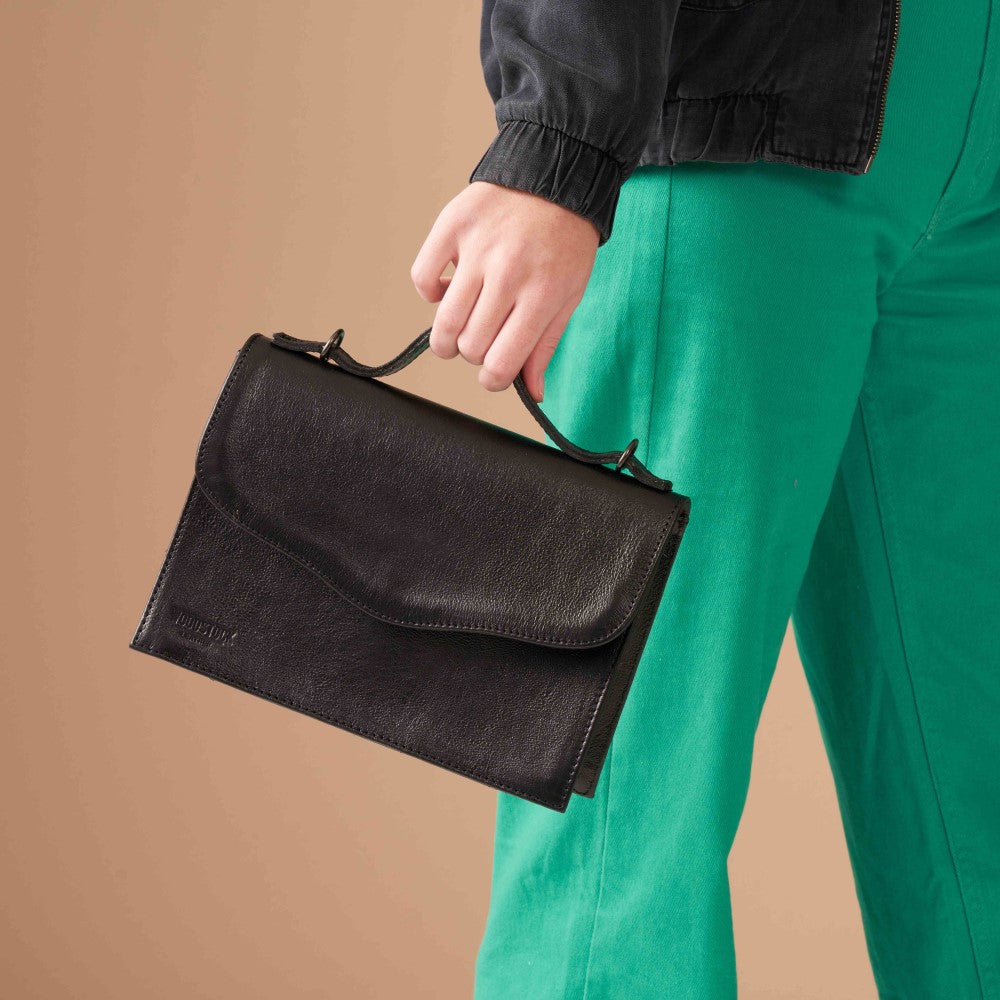 Woman with Mila Structured Sling Bag - Black  in hand
