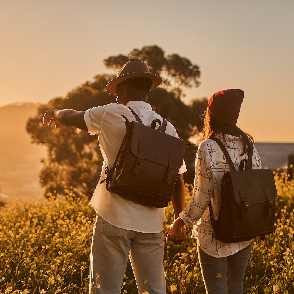 Man and woman wearing Peyton 15" Laptop Backpack in Black