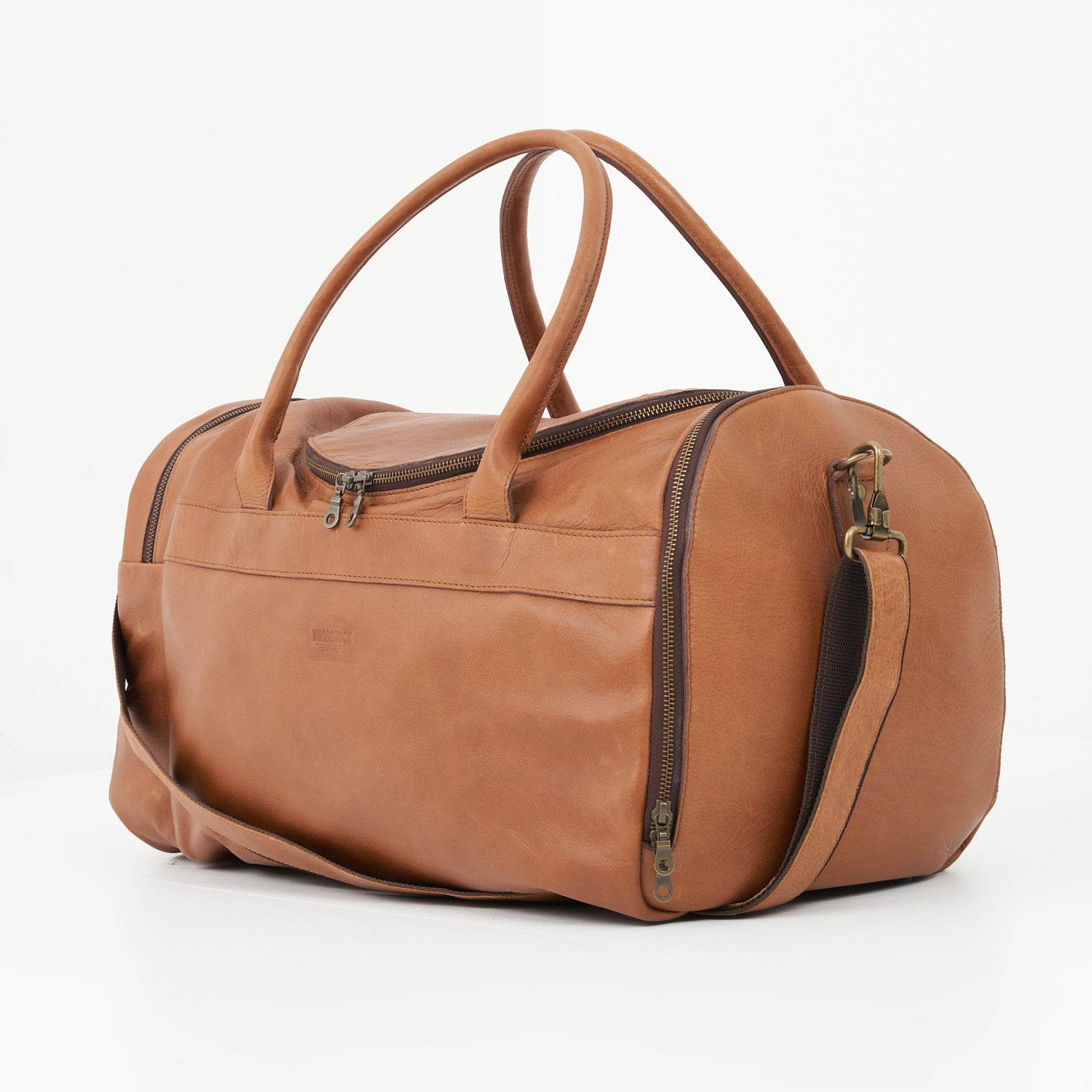 Side view of Pecan Genuine Leather Sports Duffel Bag with Waterproof Lining & Sneaker Compartment