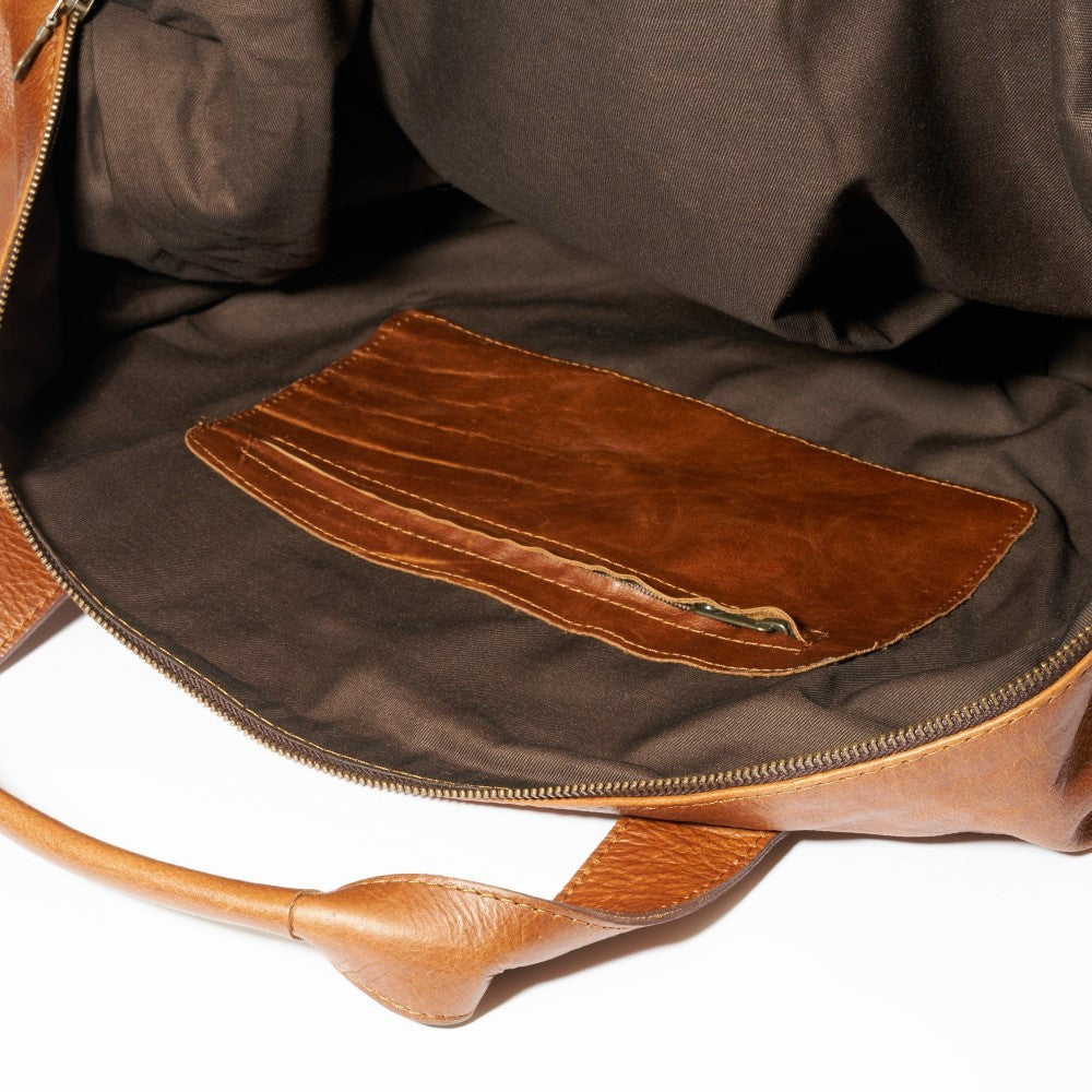 Interior view with inside compartment and zipper closure on Elliot Duffel Bag-Pecan