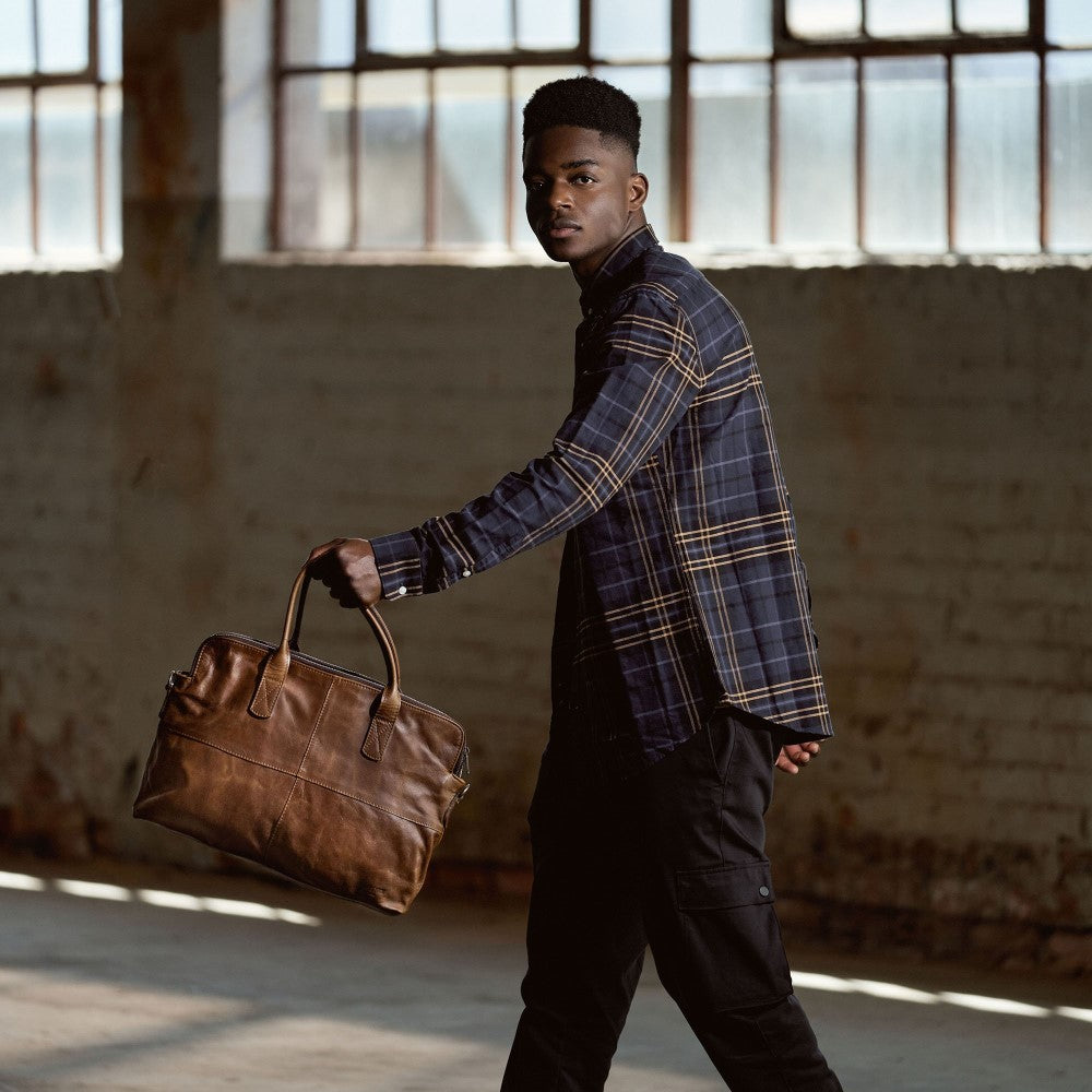 Man holding Emerson Luxury Laptop Bag-Pecan in hand