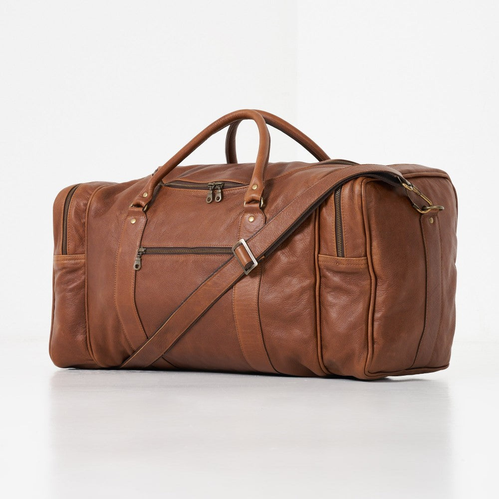 Front and side view of Finn Old School Duffel Bag - Pecan including detachable strap