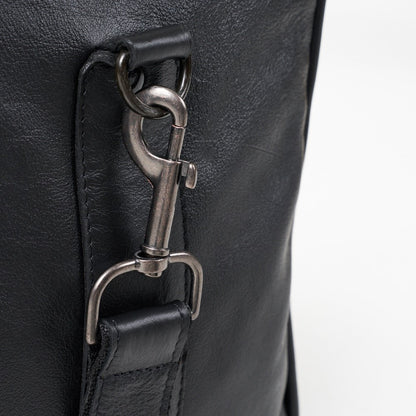 Close up view of detachable clasp on strap of Finn Old School Duffel Bag - Black