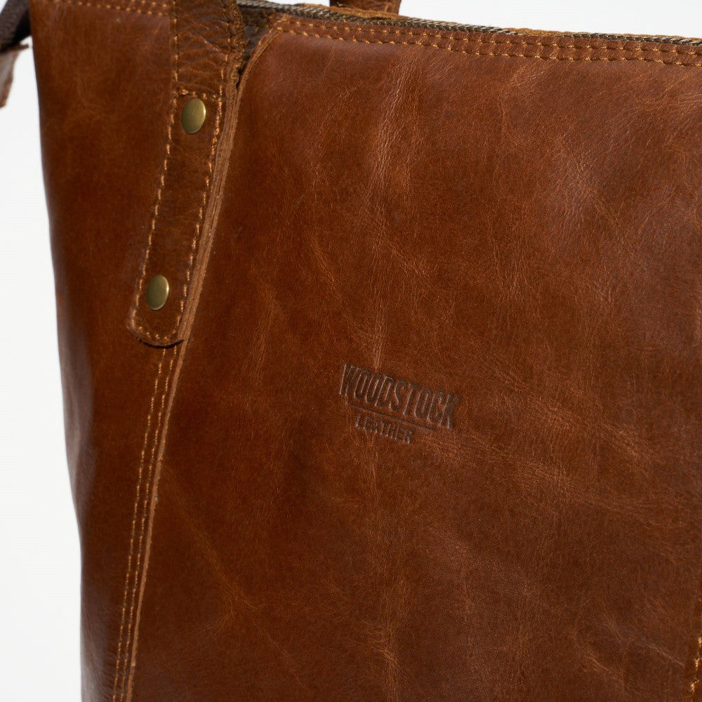 Embossed Woodstock Leather logo on the front of Helena Tote Bag-Pecan