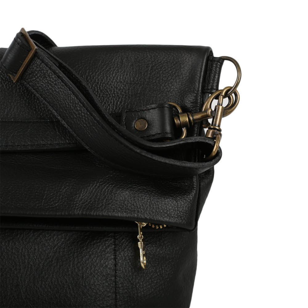 Front view of detachable straps and brass clasps on Lined Carly Sling Bag-Black