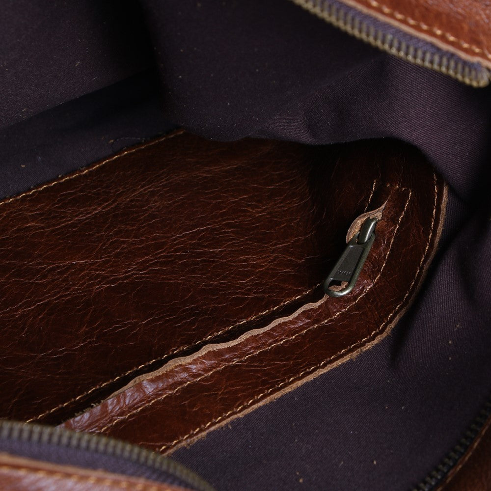 Interior zip compartment inside of  Lined Carly Sling Bag-Pecan