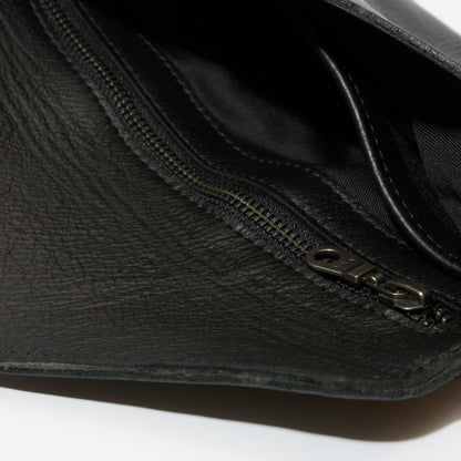 Interior view of zipper and compartment on Marley Clutch Bag - Black