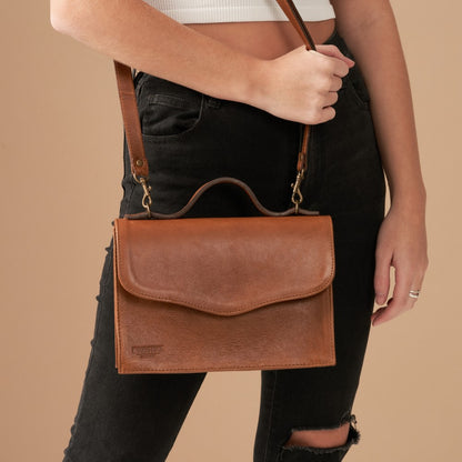 Woman with Mila Structured Sling Bag - Pecan  