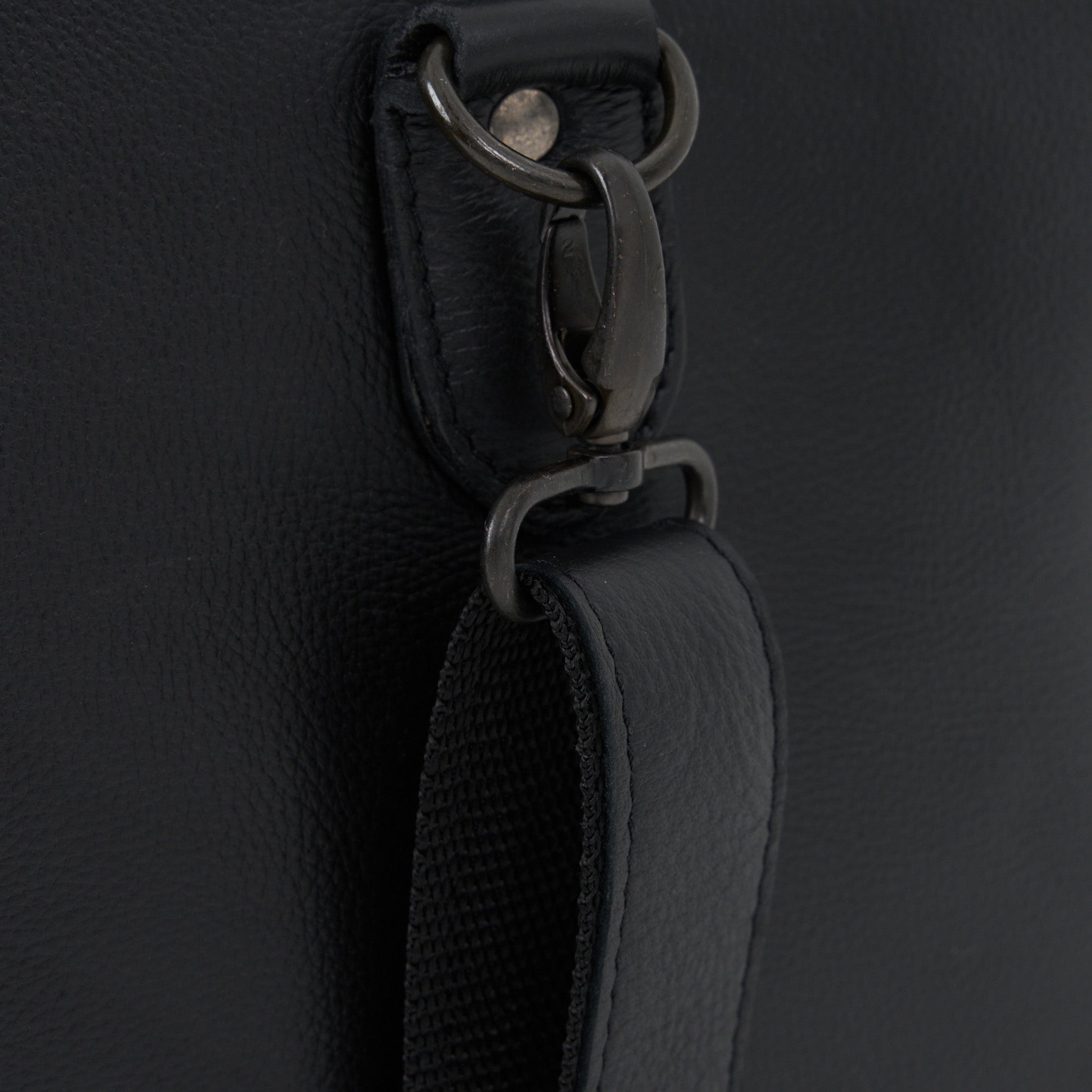 Strap detail on Black Genuine Leather Sports Duffel Bag with Waterproof Lining &amp; Sneaker Compartment